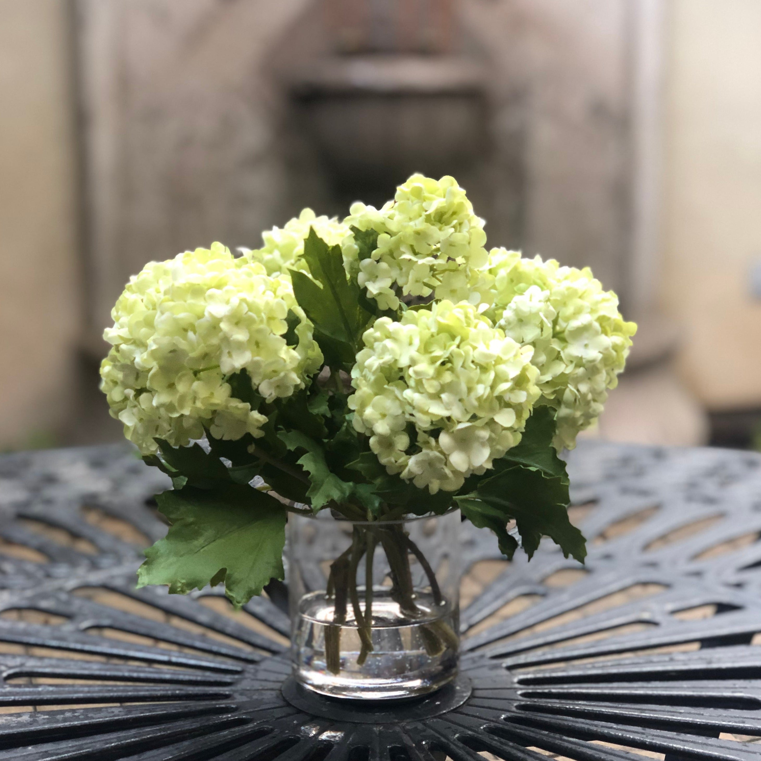 Real touch green hydrangea arrangement in glass vase - 8"