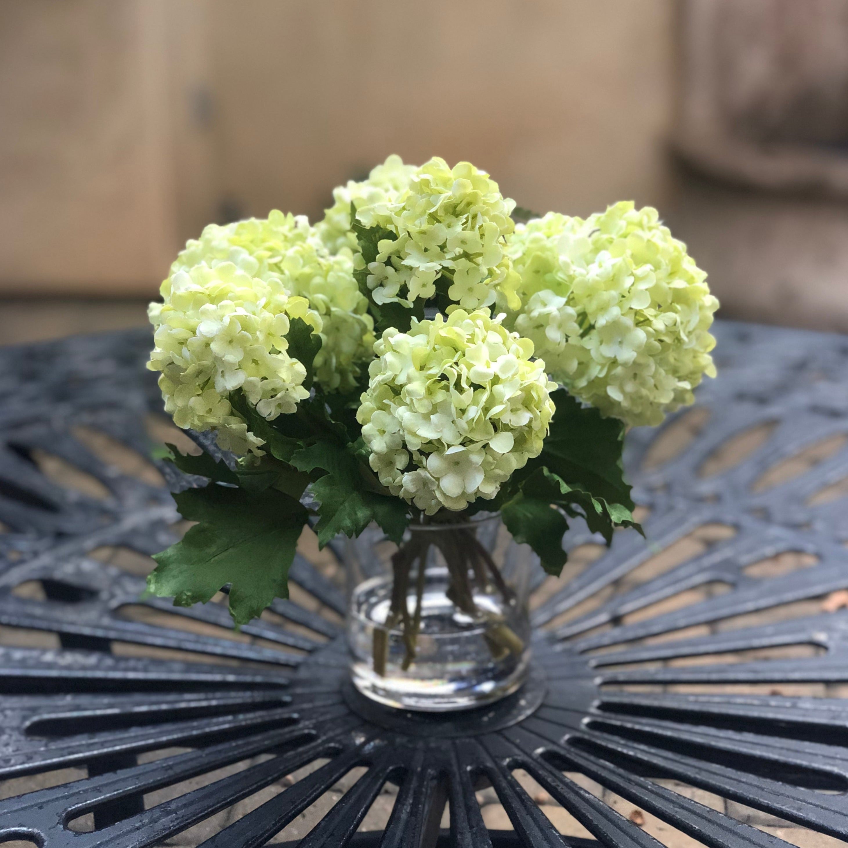 Real touch green hydrangea arrangement in glass vase - 8"